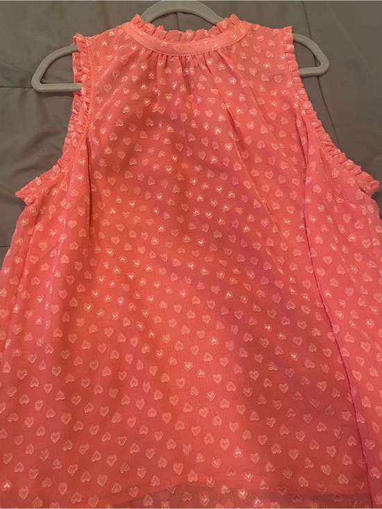 torrid Tops - torrid Coral Pink Sleeveless Heart-Print Ruffle Blouse